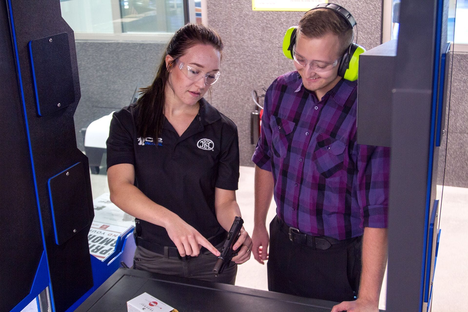 An employee teaching a trainee just starting their employment