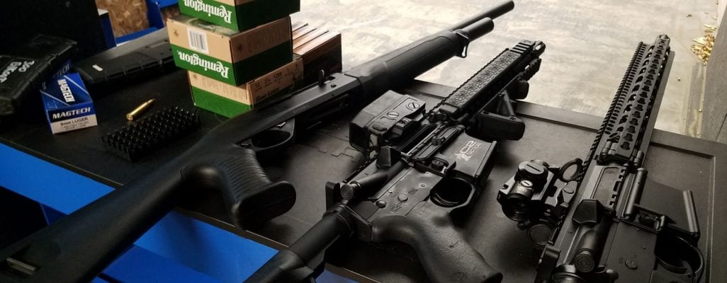 rifles and ammo on range table
