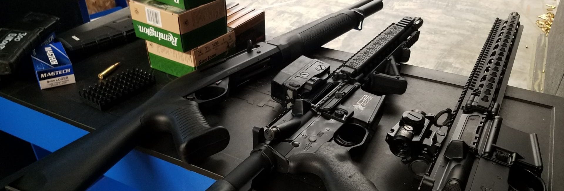 rifles and ammo on range table