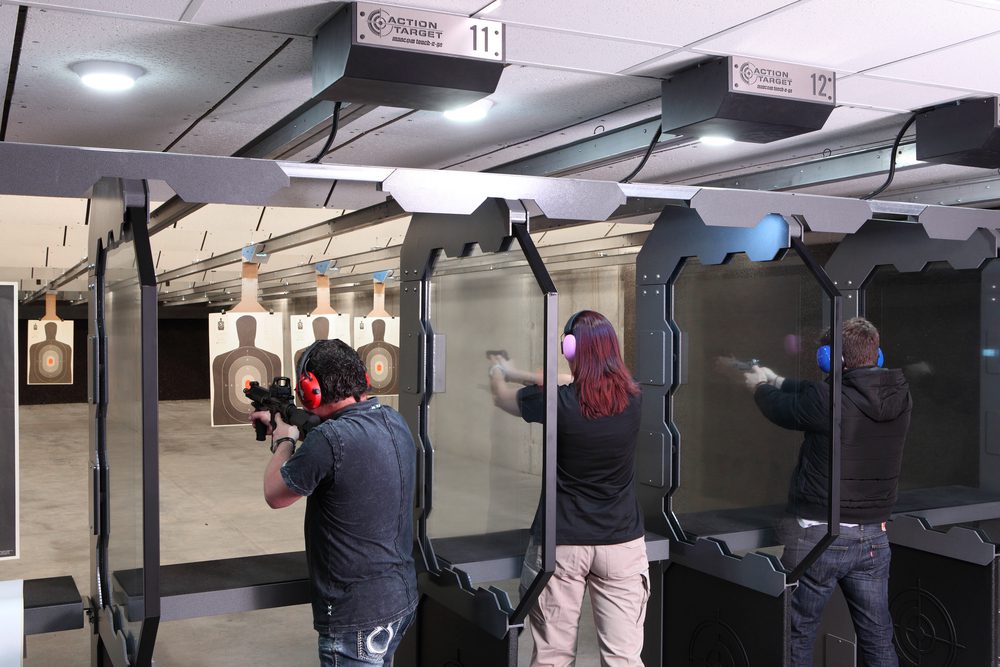 A group at a shooting range practicing range etiquette